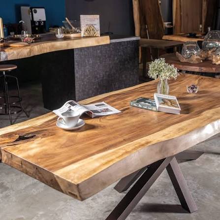 Live-edge solid wood dining table on a black steel cross base