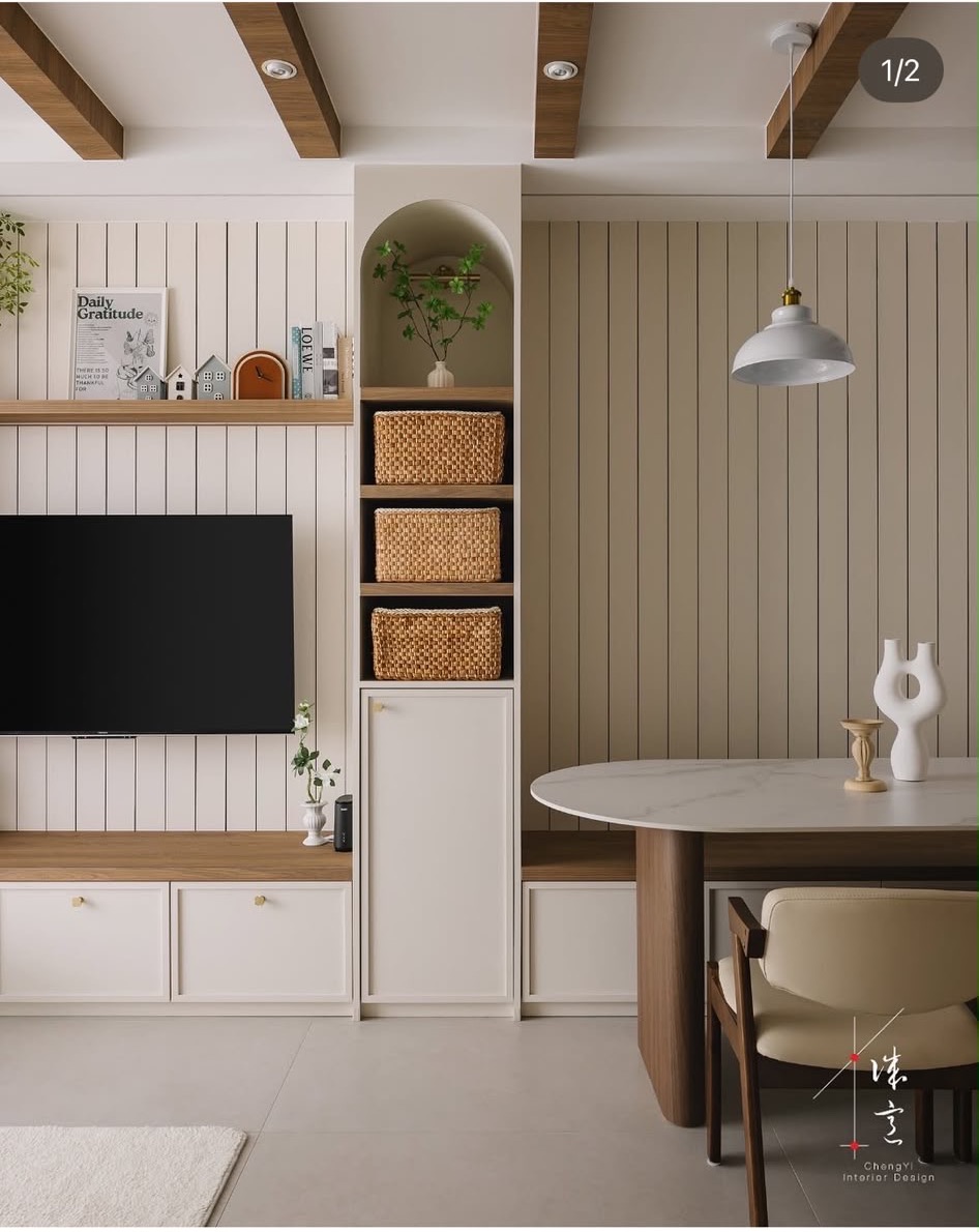 Wall of cabinetry mixing vertical panelling, an arched open niche with baskets, closed doors and a low bench, from ChengYi's portfolio